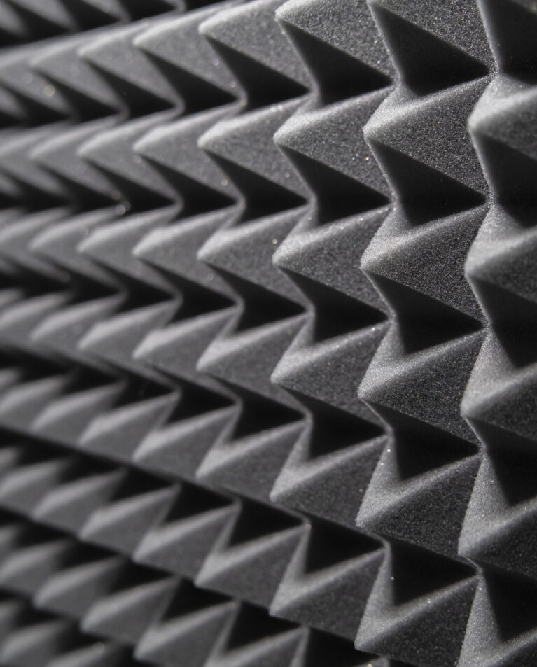 a Close-Up View of Black Acoustic Foam Panels in a Soundproof Recording Studio